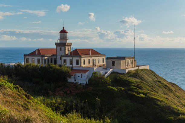 Architecture and environment of Cabo Mondego lighthouse facing the ocean. Figueira da Foz