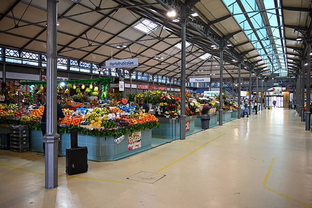 Tourists and locals shopping in the municipal market hall in Figueira da Foz, Costa de Prata, Portugal.
